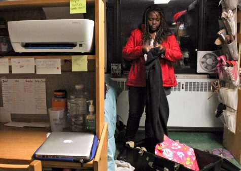 Keondra Wright, a freshman theater studies major, packs clothes in preparation for winter break in December 2015.