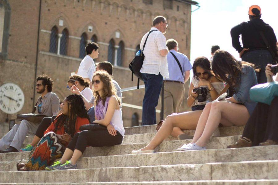 Kent State students sit on steps in Siena, Italy, during an excursion led by Associate Professor of art Gus Medicus in summer 2014. 