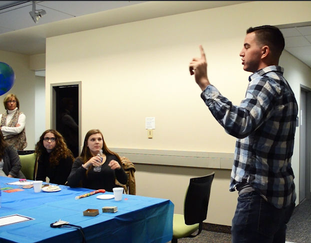 Photo courtesy of Brittney Prather. Senior public relations major Daniel Henderson speaks during a PRSSA meeting in Franklin Hall. Henderson balances PRSSA, ROTC, academics, Greek life and more as a part of his college career.