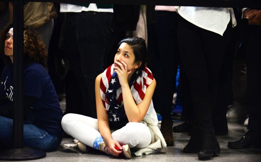 Katherine Shen, 26, of Florida watches the election poll results come in at the Jacob K. Javits Convention Center in New York City on Tuesday, Nov. 8, 2016.