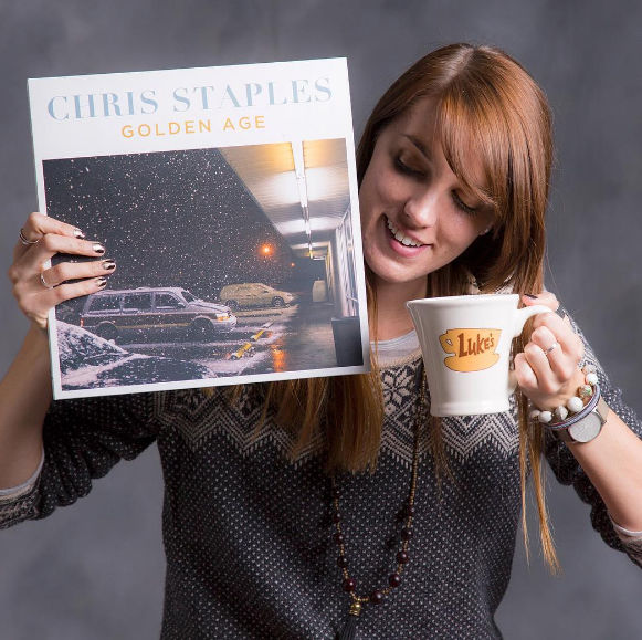 Photo courtesy of Melissa Olson via Gilmore Girls Soundtrack Blog. Melissa Olson, creator of the Gilmore Girls Soundtrack blog, shows off a Chris Staples album featuring a song from the first season. The Spotify playlist she built is called, Spinning in Stars Hollow. 
