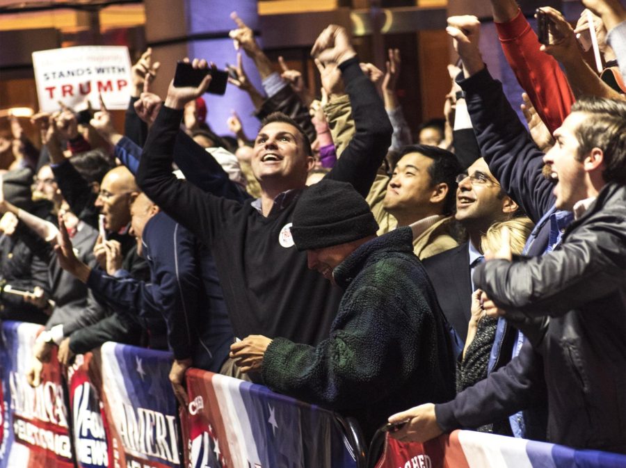 Supporters of Republican presidential nominee Donald Trump cheer outside the News Corp. Building in New York City during the early hours of Wednesday, Nov. 9, 2016, when Trump was announced the victor of the presidential election.