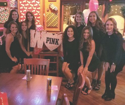 Members of Kent State PINK pose around their display at a Victorias Secret Fashion Show viewing party at Paninis in Kent on Monday, Dec. 5, 2016. 