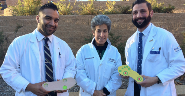 Rao, Glickman and Verdin display their insole designed to reduce foot pain for diabetes patients.  