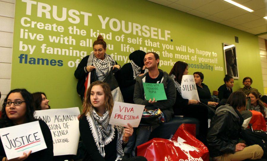 Students from Kent State's Students for Justice in Palestine participate in a sit in protesting the presence of a quote from former Israeli President Golda Meir in Bowman Hall on Thursday, Dec. 8, 2016.