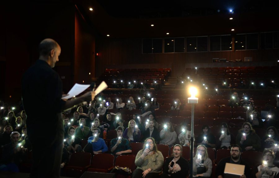 Kent State’s School of Theatre and Dance casts its cellphone lights into the air to join the Ghostlight Project in E. Turner Stump Theatre on Thursday night, Jan. 19, 2017. 