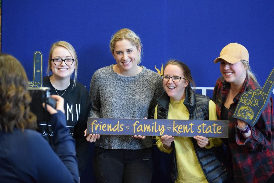 Undergraduate Student Government members smile in front of the photo booth on Thursday, Jan. 19, 2017. Sodexo, the current food vendor for Kent State, provided the booth.