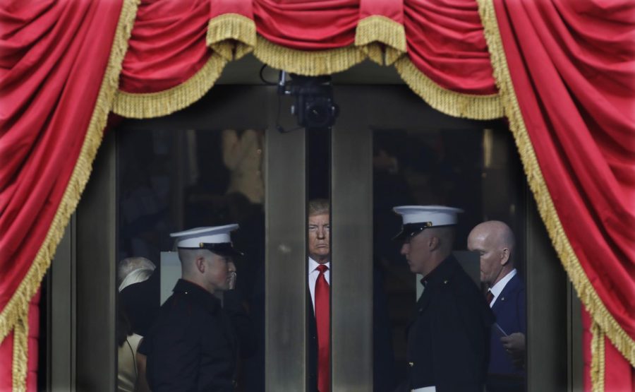 President-elect Donald Trump waits to step out onto the portico for his Presidential Inauguration at the U.S. Capitol in Washington, Friday, Jan. 20, 2017. (AP Photo/Patrick Semansky)