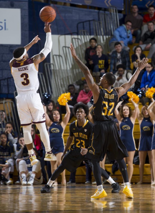 Central Michigan junior guard Marcus Keene shoots over Kent State junior guard Desmond Ridenour at the M.A.C Center on Saturday, Jan. 28, 2017. Kent State lost 98-105 in overtime.