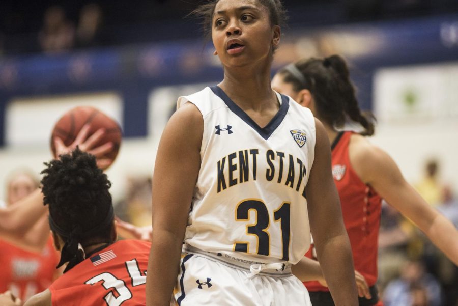 Redshirt freshman guard Megan Carter looks away after making a behind the back pass against Bowling Green State University on Saturday, Jan. 28, 2017 at the M.A.C. Center. Carter hit the game winning shot to lead the Flashes over the Falcons, 80-78.
