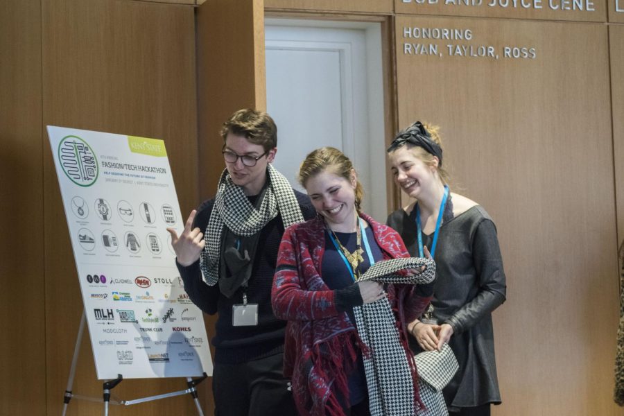University of Pittsburgh senior math major Connor Stout and Kent State fashion design majors junior Olivia Pickard and sophomore Elizabeth Tarleton celebrate after winning during the Fashion Tech Hackathon Awards Ceremony at the College of Architecture & Environmental Design building on Sunday, Jan. 29, 2017.