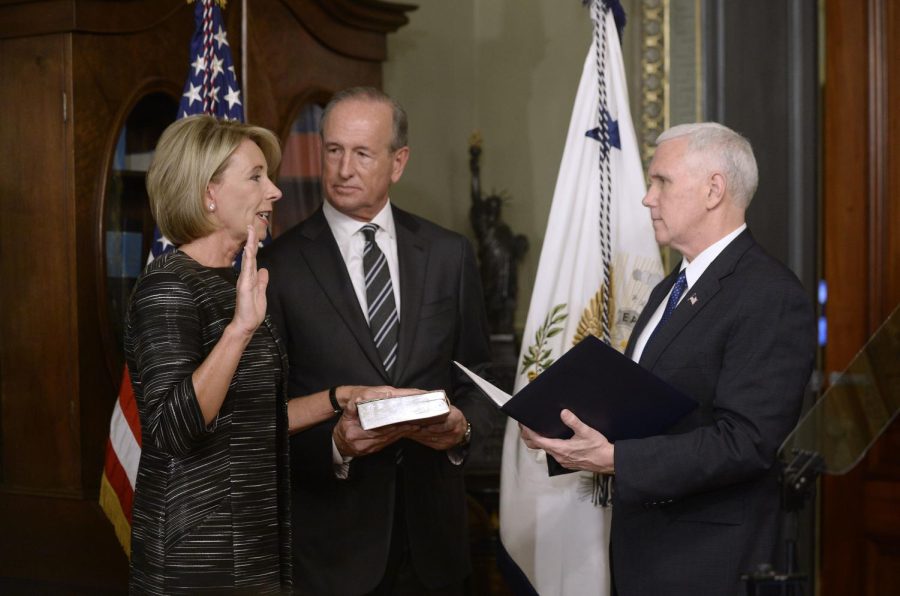 U.S. VP Mike Pence, swears in Betsy DeVos , as the Education Secretary in the Vice Presidents Ceremonial Office in the Eisenhower Executive Office Building of the White House on February 7, 2017 in Washington, D.C.