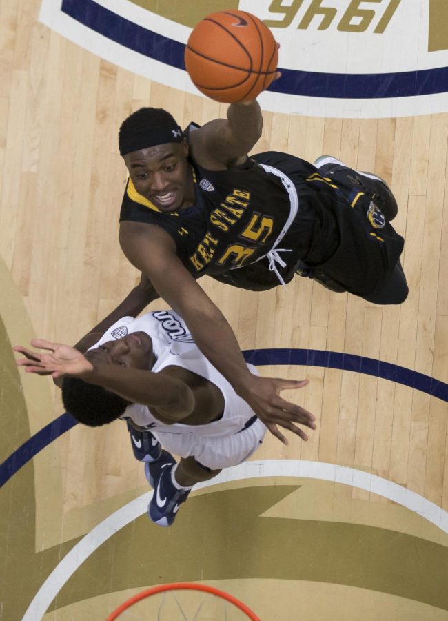 Kent State senior forward Jimmy Hall shoots over Akron redshirt freshman Emmanuel Olojakpoke at the James A. Rhodes Arena on Friday, Feb. 17, 2017. Kent State beat Akron, 70-67.