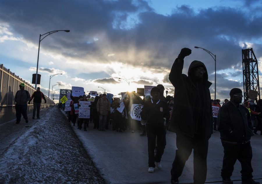 Demonstrators march across the Veterans Memorial Bridge in Cleveland, Ohio. The demonstrators continued toward the citys downtown to assemble in front of the court house and city hall in order to show their opposition to President Donald Trump’s immigration ban on Friday, Feb. 3, 2017.