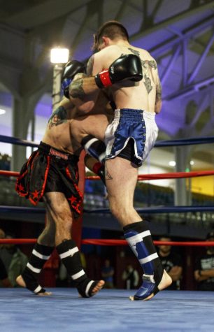 Nikolai Gionti knees his opponent Billy Freedson during the co-main event heat at the Goodyear Hall in Akron, Ohio on Wednesday, Nov. 23, 2016.