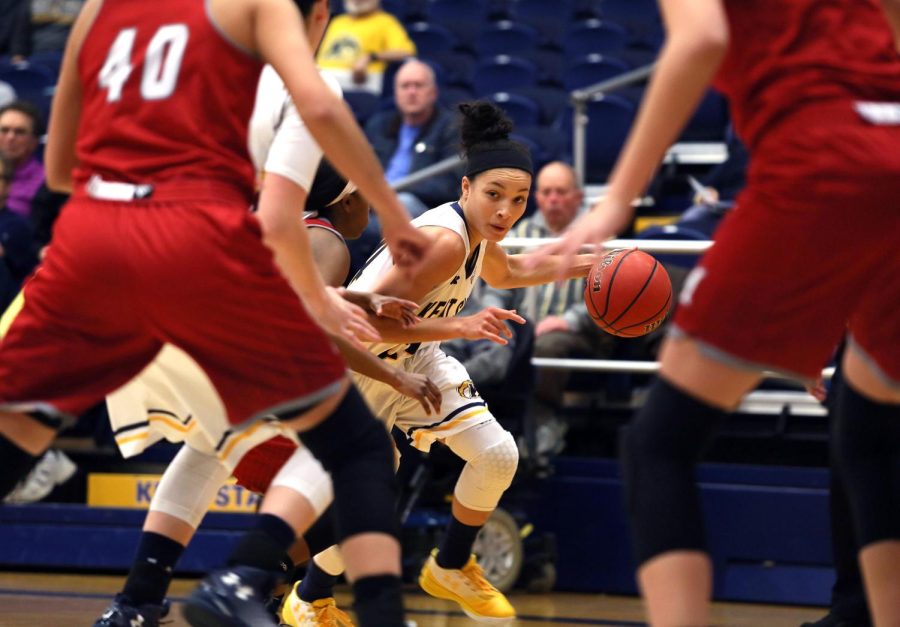 Alexa Golden, Sophomore point guard dribbles past the University of Miami defense in a game at the M.A.C. Center on Feb. 1, 2017. The Golden Flashes won 84 to 66.