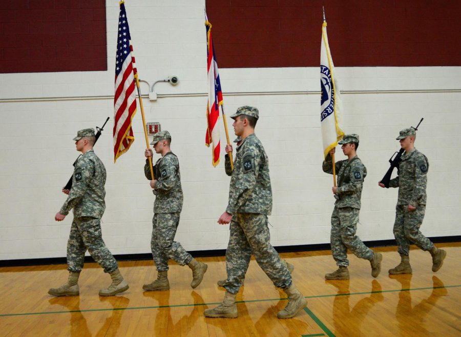 Kent+State+ROTC+members+carry+flags+as+a+closing+ceremony+for+the+Wheels+for+Change+event+in+the+Student+Recreation+and+Wellness+Center+on+Saturday%2C+Feb.+25%2C+2017.+Wheels+for+Change+supports+veterans+by+giving+them+bikes+for+transportation+and+providing+fitness+opportunities.