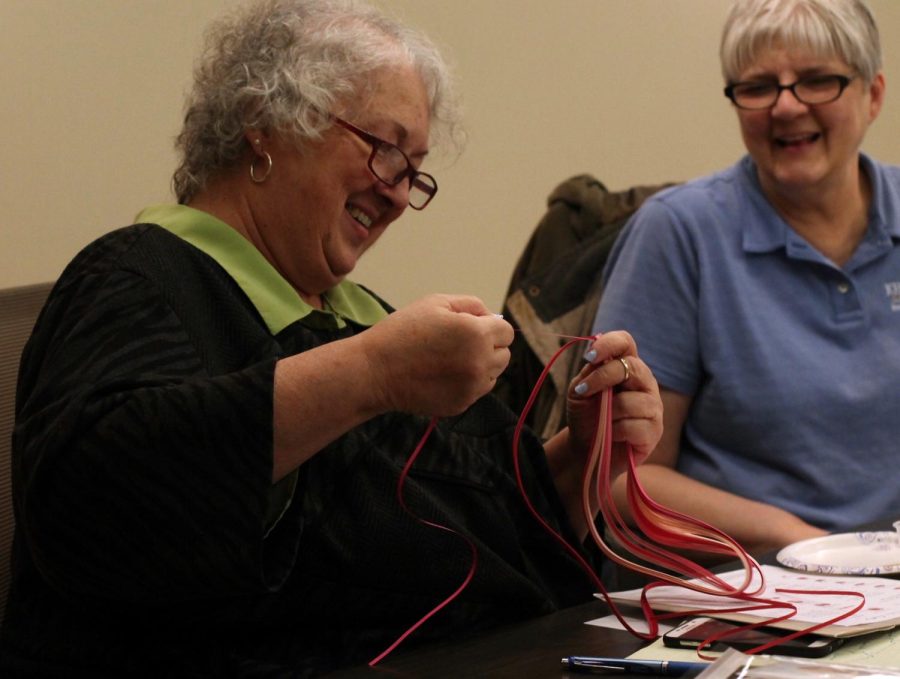 Jan Radar and Diana Ryman, attendees of the Womens Centers Quilling Workshop, put their skills to work during the event on Wednesday, Feb. 8, 2017. 