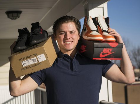 Matthew Azyenberg, a junior entrepreneurship and marketing major, holds his shoe merchandise at Province apartments in Kent, Ohio on Monday, Feb. 13, 2017