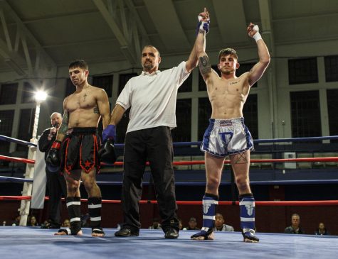 Nikolai Gionti raises in victory after the final amateur bout of his career on Wednesday, Nov. 23, 2016.