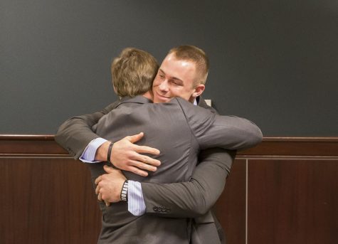 Former Kent State football player Nate Holley hugs his brother Nick after a verdict was reached by a jury at the Portage County Municipal Courthouse on Ravenna, Ohio on Thursday, Feb. 9, 2017. Holley was found not guilty on all charges.