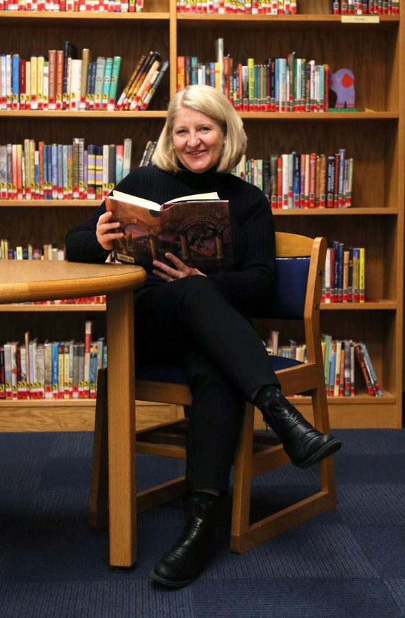 Marianne Martens poses for a portrait in the the Reinberger Children’s Library Center with Harry Potter and The Sorcer’s Stone. Martens is scheduled to speak at the TEDxKent event on Saturday, Feb. 18, 2017 in Cartwright Hall.
