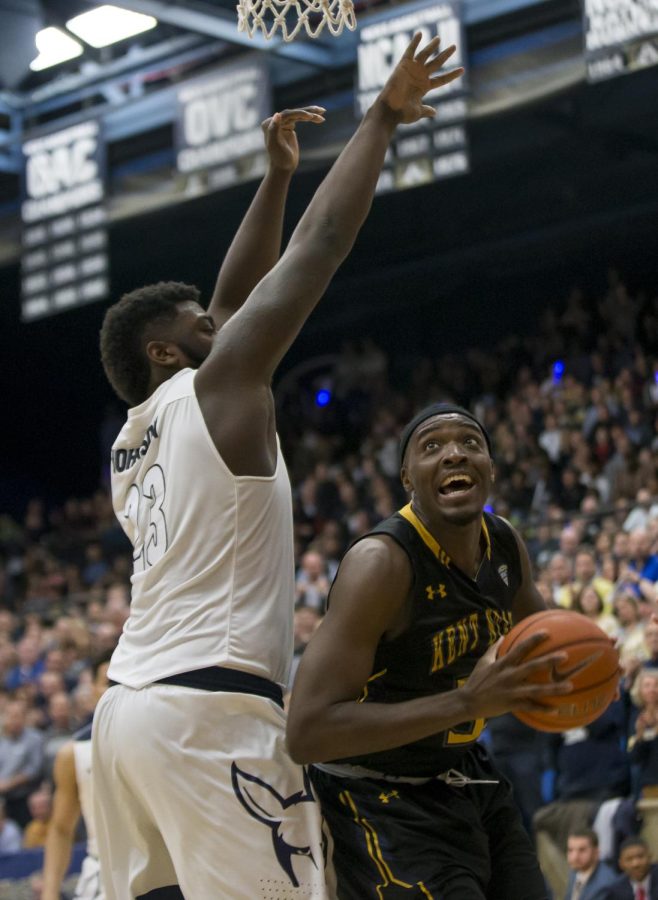 Kent State senior forward Jimmy Hall makes a move to the rim against Akron senior center Isaiah Johnson at the James A. Rhodes Arena on Friday, Feb. 17, 2017. Kent State beat Akron, 70-67.