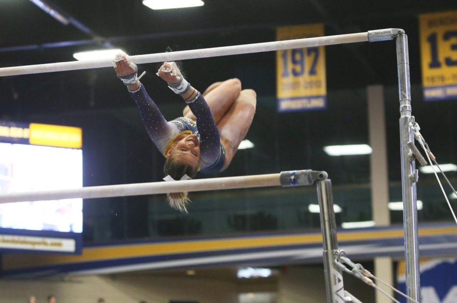 Kent State junior Rachel Stypinski competes on the uneven bars at a meet against West Virginia at the M.A.C. Center on Saturday, Feb. 4, 2017. Kent State lost 195.950-194.875.