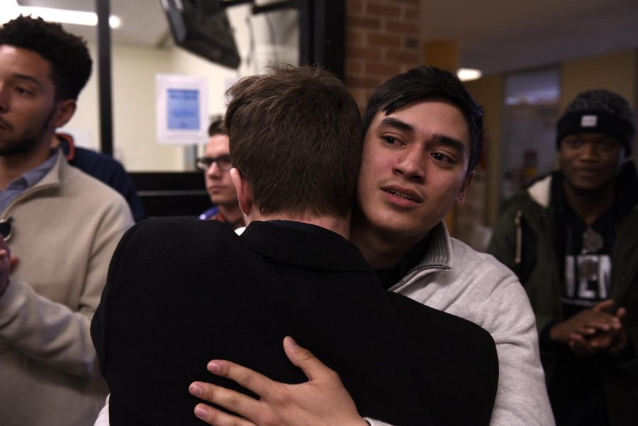 Logan Pringle (left) and Daniel Oswald (right), both candidates for the USG presidency, hug after Oswald was announced as the new USG president on Thursday, March 16, 2017.