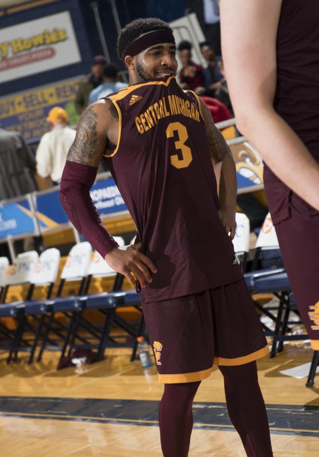 Central Michigan junior guard Marcus Keene bites his jersey while waiting to shake hands with Kent State after loosing in overtime 116-106 in the first round of the MAC Mens Basketball Tournament at the M.A.C. Center on Monday, March 6, 2017. Keene had a game high 41 points.