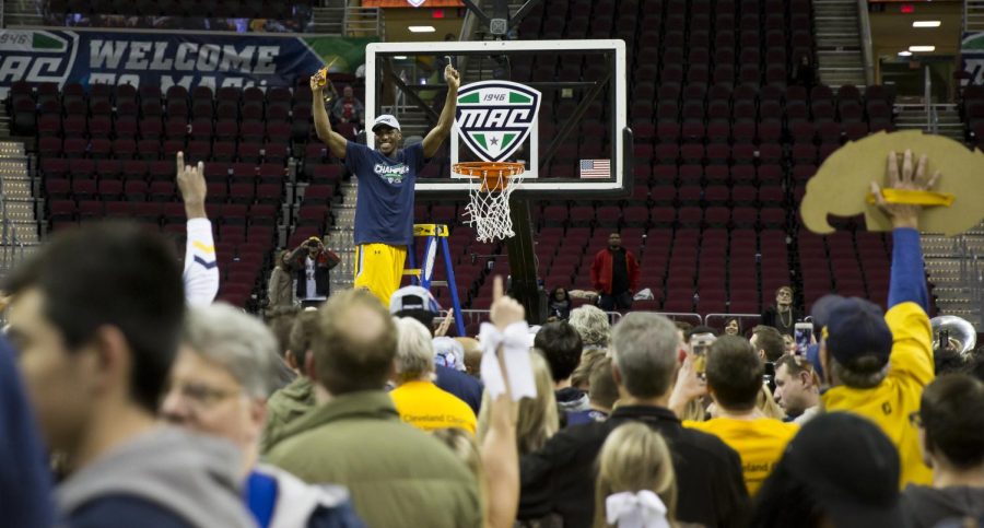 Kent State senior guard Deon Edwin celebrates after cutting down the net at Quicken Loans Arena in Cleveland, Ohio on Saturday, March 11, 2017. Kent State beat Akron in the MAC Championship game 70-65.
