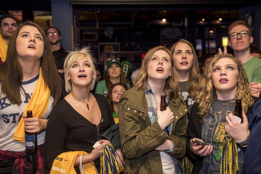Kent State fans anxiously watch the Kent State vs. UCLA games at Water Street Tavern on Friday, March 17, 2017. The game ended with a loss for the Flashes, 80-97.