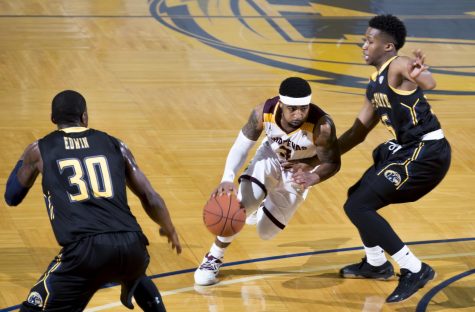 Central Michigan junior guard Marcus Keene drives the lane against Kent State junior guard Kevin Zabo at the M.A.C Center on Saturday, Jan. 28, 2017. Kent State lost 105-98 in overtime.