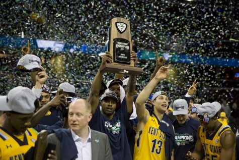 The Kent State Mens Basketball team holds the the MAC Championship trophy after beating Akron 70-65 at Quicken Loans Arena in Cleveland, Ohio on Saturday, March 11, 2017. Kent State punched their ticket to the NCAA Tournament.