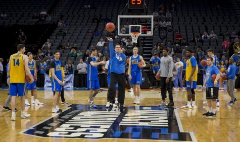 UCLA coach Steve Alford takes a half-court shot during the Bruins open practice at the Golden 1 Center in Sacramento, California on Thursday, March 16, 2017.