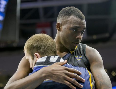 Kent State senior forward Jimmy Hall and senior guard Jon Fleming embrace after Hall fouled out against UCLA during the first-round of the NCAA Tournament in Sacramento, California on Friday, March 17, 2017. Kent State lost 97-80.