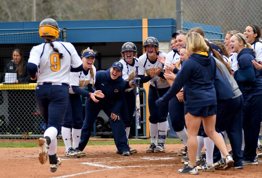 Kent State senior infielder Maddy Grimm jogs into home base after hitting a home-run against Ohio University Tuesday April 4, 2017. The Flashes would go on to win their 7-1.