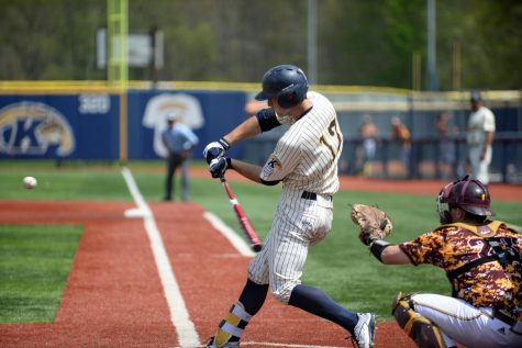 Sophomore catcher Pete Schuler bunts the ball on April 30, 2017 at Schoonover Stadium. Kent State won their game against Central Michigan 6-5.