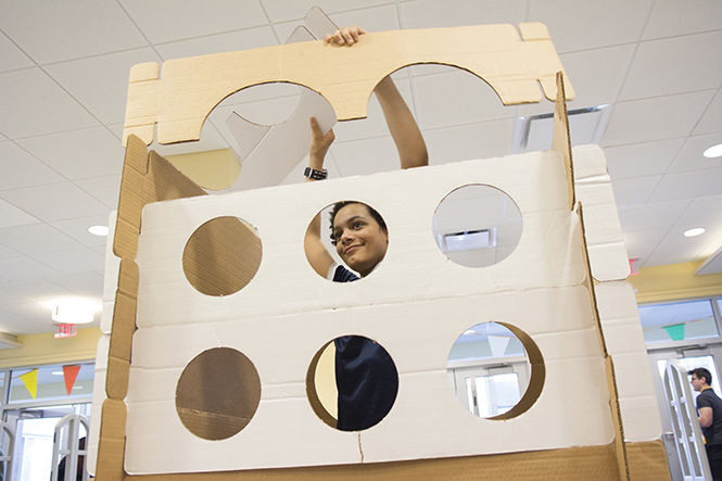 Jagger Smith, age 12, builds a house as tall as he is using the Cocoro playhouse system, showcased at the Maker Faire in the University Library on Friday, May 10, 2015. The Cocoro playhouse, which uses lightweight but durable cardboard that can be stacked and combined for limitless possibilities, was created by NorioKids, who’s founder got the idea from playing with legos and lincoln logs as a kid and always wanting to be able to fit inside.