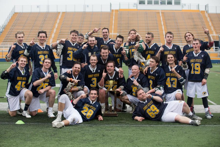 The Kent State club lacrosse team poses with the NCLL Midwest North Conference championship trophy after beating Penn State Altoona on Saturday, April 29, 2017