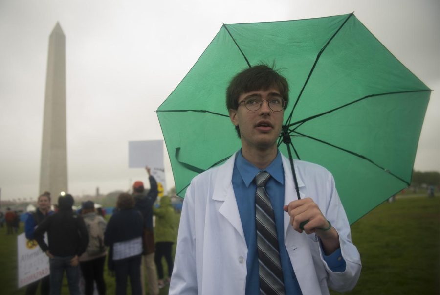 Third-year graduate student David Ruth from New Hampshire stands on the National Mall lawn in Washington, D.C. on Saturday, April 22, 2017. Ruth is working to get his doctorate in nuclear physics. “Publicly funded science has done a lot for us. Its brought us to where we are in modern civilization. I feel a really big draw to be able to understand things that arent necessarily intuitive. ... Even if you dont make some big discovery, every scientist plays at least some part in expanding our knowledge, Ruth said. 