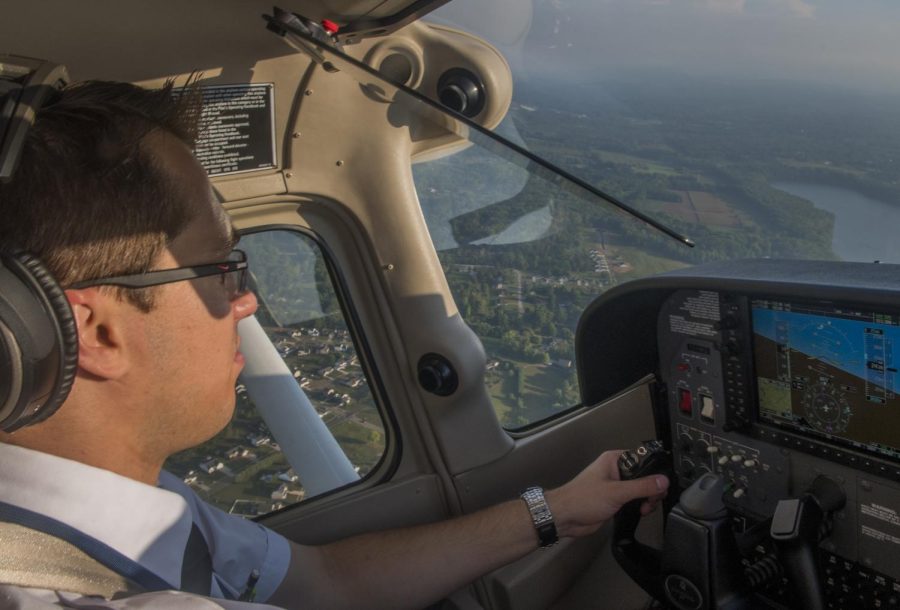 Jimmy Bufalino is a senior flight technology major and is one of a dozen or so other pilots who are giving visitors rides in small aircraft at the 20th Kent State Aeronautics Fair Saturday Sept. 10, 2016.