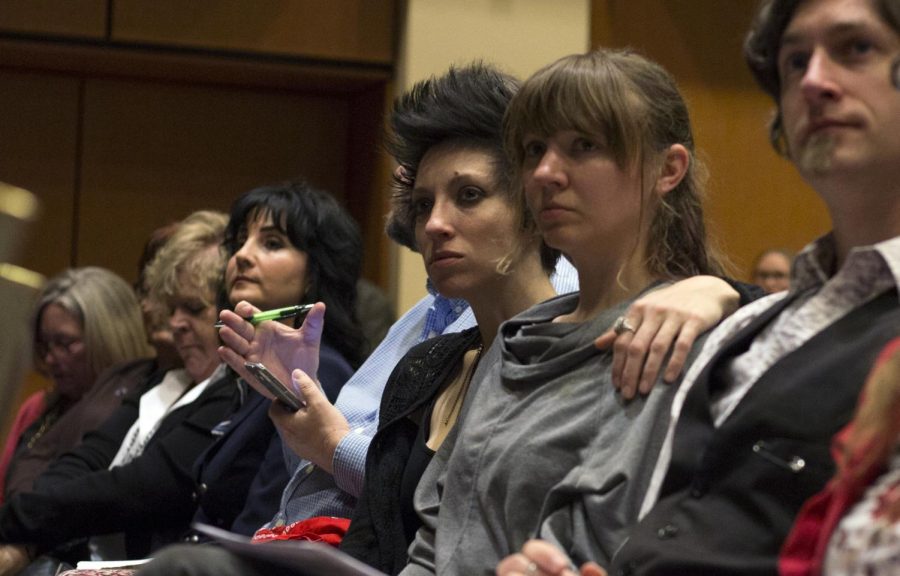 Audience members Angie Haze and Meryl Hornyak listen to speakers at the 47th annual May 4th Commemoration in the Kent State University Ballroom on Thursday, May 4, 2017.