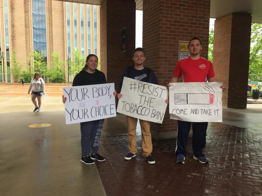 Members of the Young Americans for Liberty group at Kent State hold up signs May 1 protesting the smoking ban set to begin on July 1 of this year.