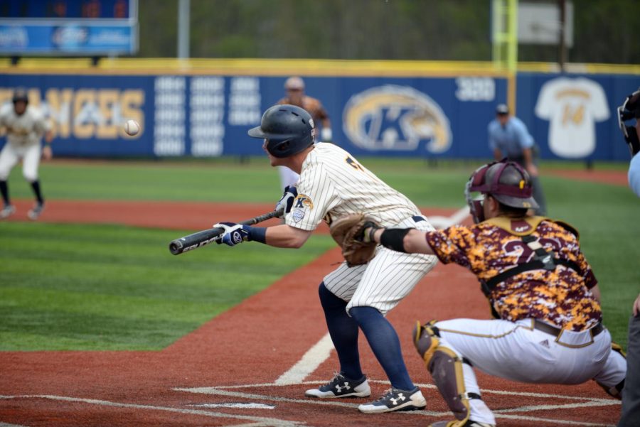 Kent State junior outfielder Reilly Hawkins bunts the ball against Central Michigan at Schoonover Stadium on April 30, 2017. Kent State won 6-5.