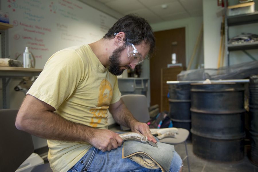 Assistant anthropology professor Dr. Metin Eren creates replicas of excavated, ancient weapons in his lab on Thursday, April 27, 2017. “It’s fun to recreate technology from the past to learn about people’s lives,” said Dr. Eren.
