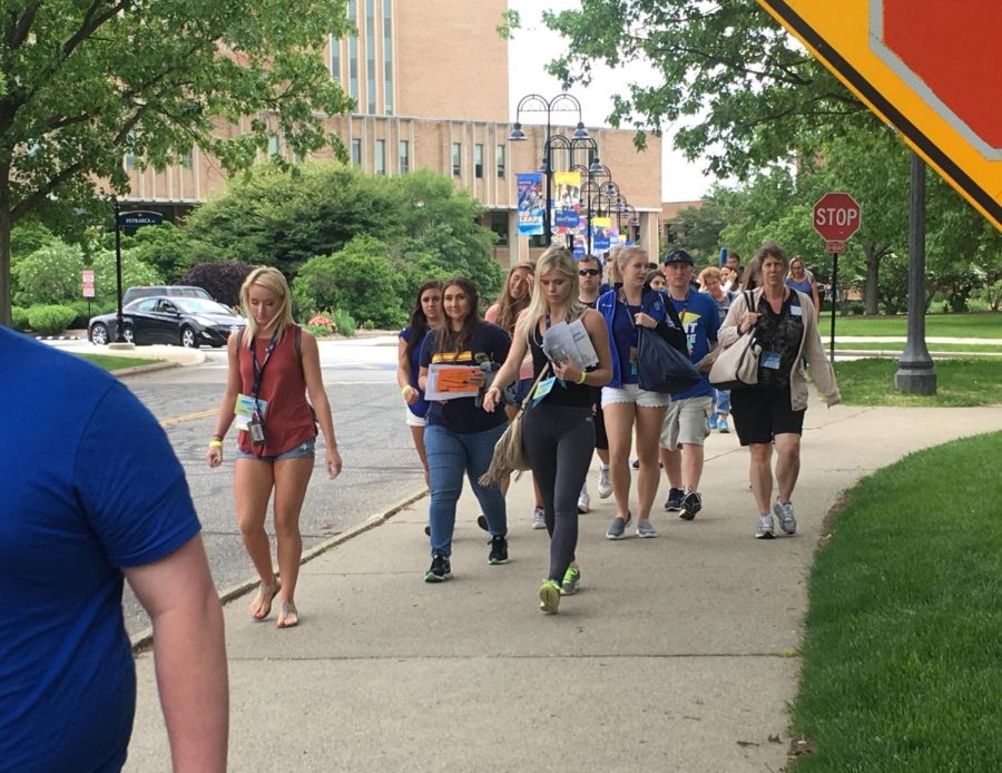 Incoming students and their parents walk toward Eastway during Destination Kent State on Monday, June 5, 2017.