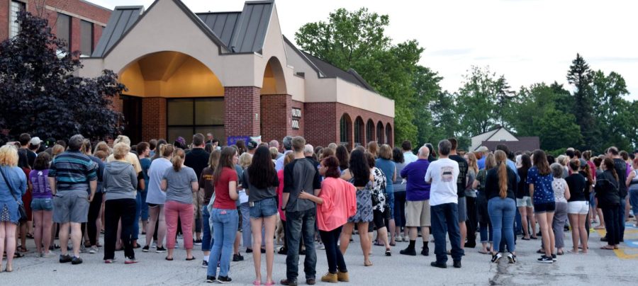 Community members and family loved ones gather outside of North Royalton High School on Wednesday, June 14, 2017, for a candlelight vigil to remember the lives of Suzanne Taylor and her daughters, Taylor and Kylie Pifer. 