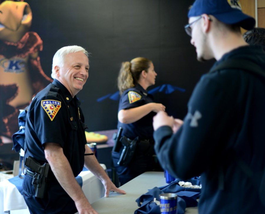 Assistant Chief of Police William Buckbee serves coffee to Chad Morrison in the Nest at Kent State on September 14, 2016. Wednesday afternoon, police hosted “Coffee with a Cop,” to pass out free coffee to students so they could answer any questions students had about their services.