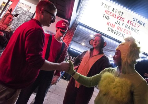 Friends meet outside the Kent Stage and enjoy the warm weather during the Kent Halloween festivities on Saturday, Oct. 29, 2016.